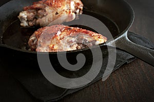 Fried turkey leg in iron pan