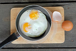 Fried twin eggs with pan