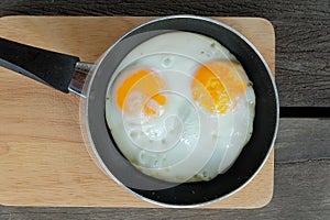 Fried twin eggs with pan