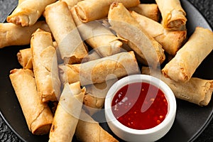 Fried vegetable spring rolls with sweet chilli sauce, party food