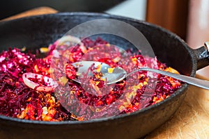 Fried vegetables on a frying pan