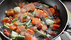 Fried vegetables in a frying pan