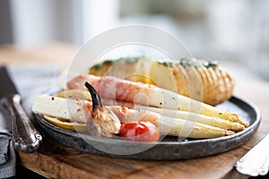 Fried white asparagus wrapped in bacon