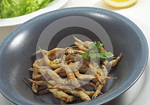 FRIED WHITEBAIT osmerus eperlanus WITH PARSLEY photo