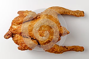 Fried whole chicken on a white background