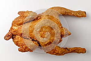 Fried whole chicken on a white background photo