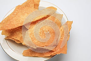 Fried wontons with minced pork meat on white background.