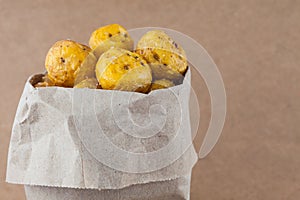 Fried yellow potato isolated in beige background
