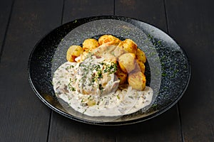 Fried zander fillet with mushroom sauce and potato balls