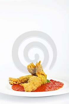 Fried zucchini flowers stuffed with ricotta and ham