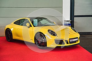 FRIEDRICHSHAFEN - MAY 2019: yellow PORSCHE 911 991 CARRERA GTS coupe 2014 at Motorworld Classics Bodensee on May 11, 2019 in