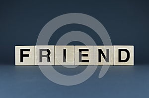 Friend. Cubes form the word Friend