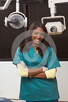 Friendly African-American dentist woman in office