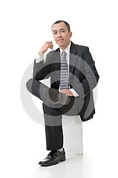 Friendly Asian business man sit