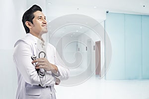 Friendly of asian doctor man with white lab coat and stethoscope