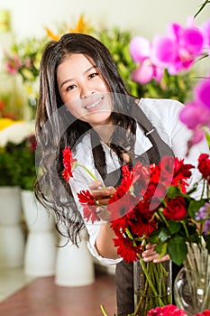 Chinese Saleswoman in a flower shop photo