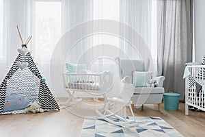 Friendly baby room decor in white and blue