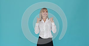 Friendly Caucasian Woman Showing Heart Shape on Blue Background