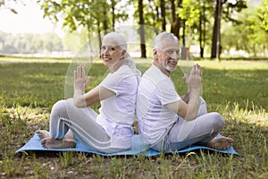 Friendly couple doing meditation together stock photo