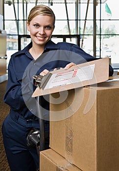 Friendly delivery woman in uniform