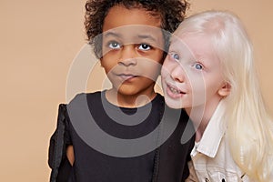 Friendly diverse children posing at camera isolated