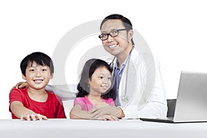 Friendly doctor with children 2