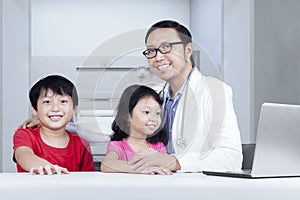 Friendly doctor with children