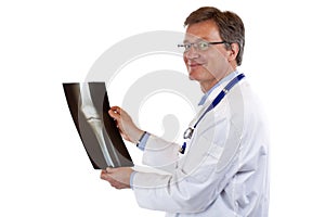 Friendly doctor holds knee x-ray and smiles