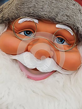 Friendly Face of Santa claus with blue eyes and a white beard