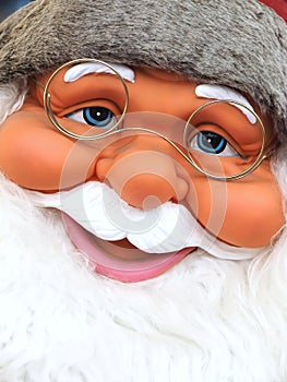 Friendly Face of Santa claus with blue eyes and a white beard