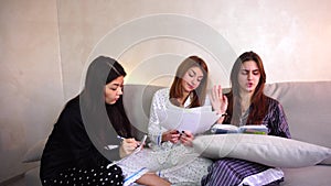 Friendly female american students disscuss project for college