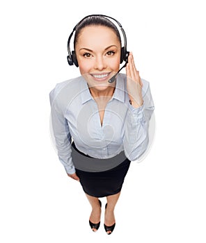 Friendly female helpline operator with headphones