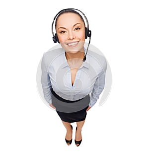 Friendly female helpline operator with headphones