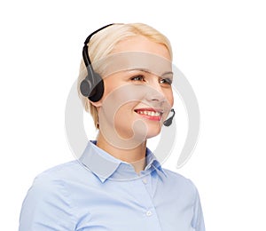 Friendly female helpline operator with headphones