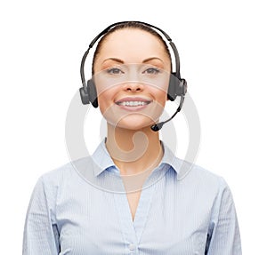 Friendly female helpline operator with headphones