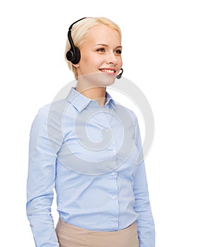 Friendly female helpline operator with headphones