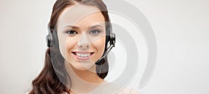 Friendly female helpline operator with headphones