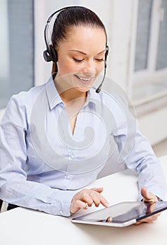 Friendly female helpline operator with tablet pc