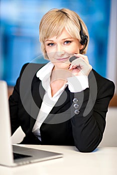 Friendly female operator with headset