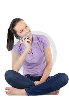 Friendly young adult woman or girl talking or listening with cellphone, white background, vertical