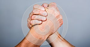 Friendly handshake, friends greeting, teamwork, friendship. Handshake, arms, friendship. Hand, rivalry, vs, challenge