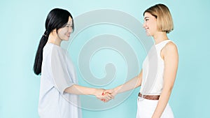 friendly handshake happy women first meeting photo