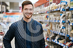 Friendly handsome man in a hardware store