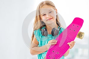 Friendly little girl with penny board