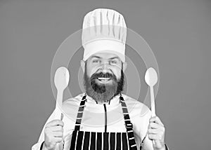 Friendly look. Vegetarian. Mature chef with beard. Bearded man cook in kitchen, culinary. Healthy food cooking. Chef man