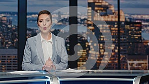 Friendly newsreader speaking newscast evening studio closeup. Tv broadcasting