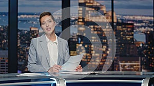 Friendly newsreader speaking newscast evening studio closeup. Tv broadcasting