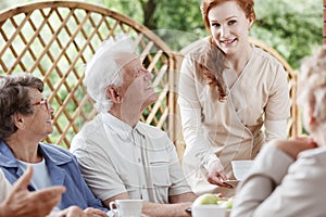 Friendly nurse meets with patients