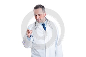 Friendly pediatrician playing with soap bubble