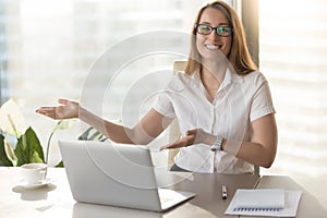 Friendly receptionist invites visitors on meeting